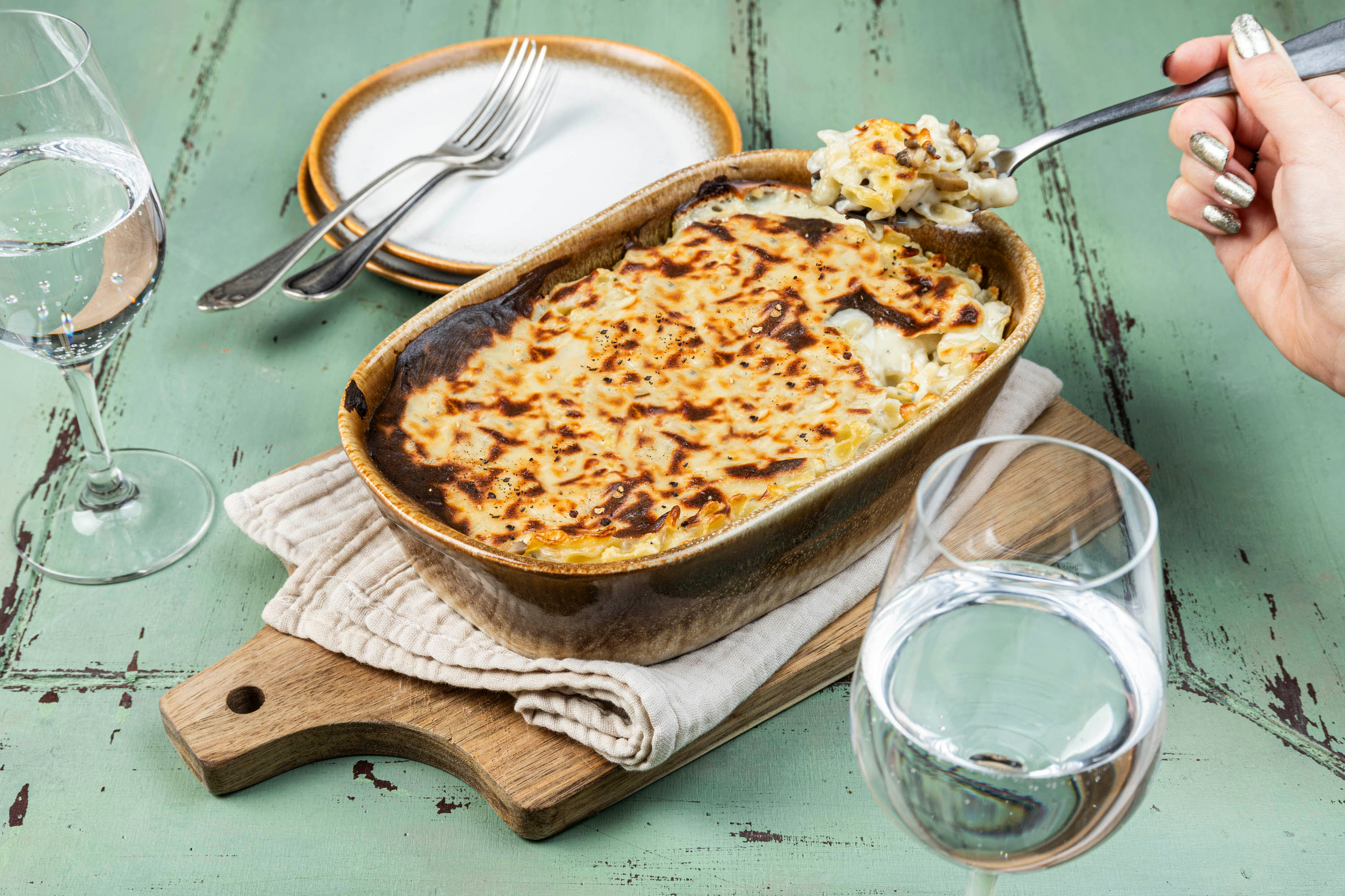 Gratin de farfalline aux champignons et trois fromages